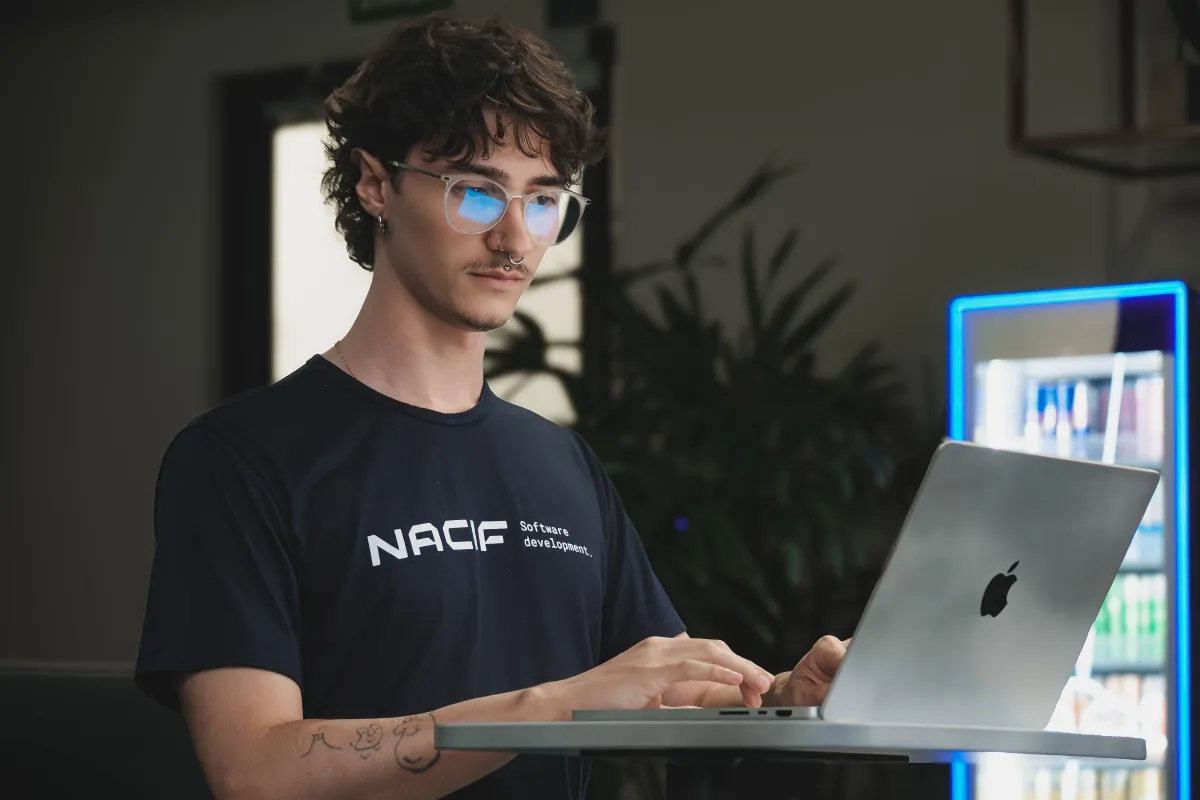 A Nacif engineer working on a laptop at the studio